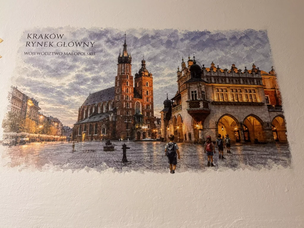 Grafika edukacyjna Kraków Rynek Główny i Sukiennice - bezpośredni druk ścienny UV na szkolnym korytarzu