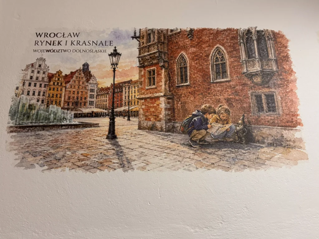 Grafika edukacyjna Wrocław Rynek i Krasnale - bezpośredni druk ścienny UV na szkolnym korytarzu