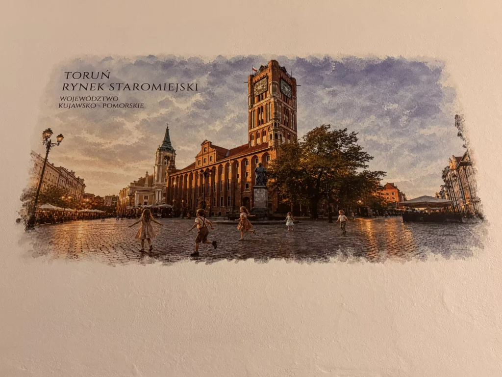 Grafika edukacyjna Toruń Rynek Staromiejski - bezpośredni druk ścienny UV na szkolnym korytarzu w Ozimku